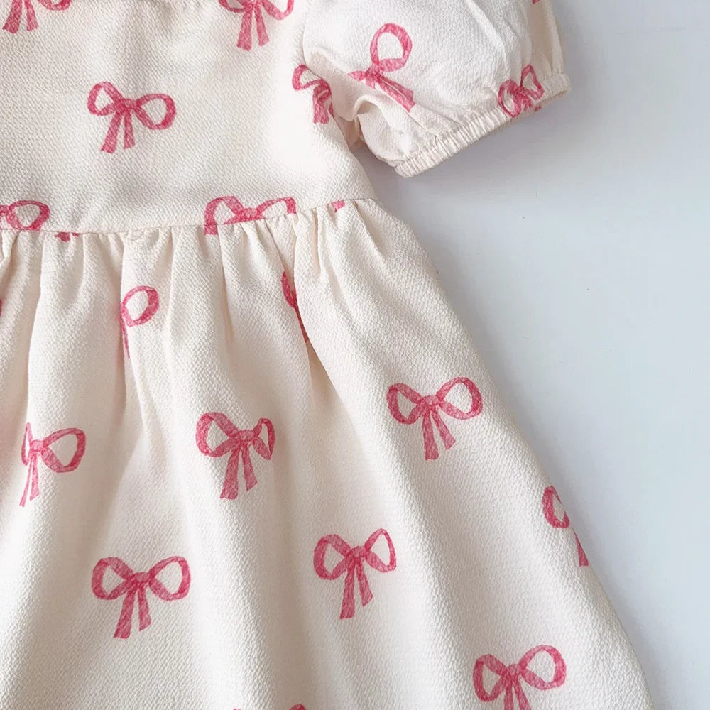 فستان صيفي للبنات من بير ليدر - فستان كاجوال بأكمام قصيرة مطبوع عليه فيونكة، مناسب للأعمار من 3 إلى 7 سنوات